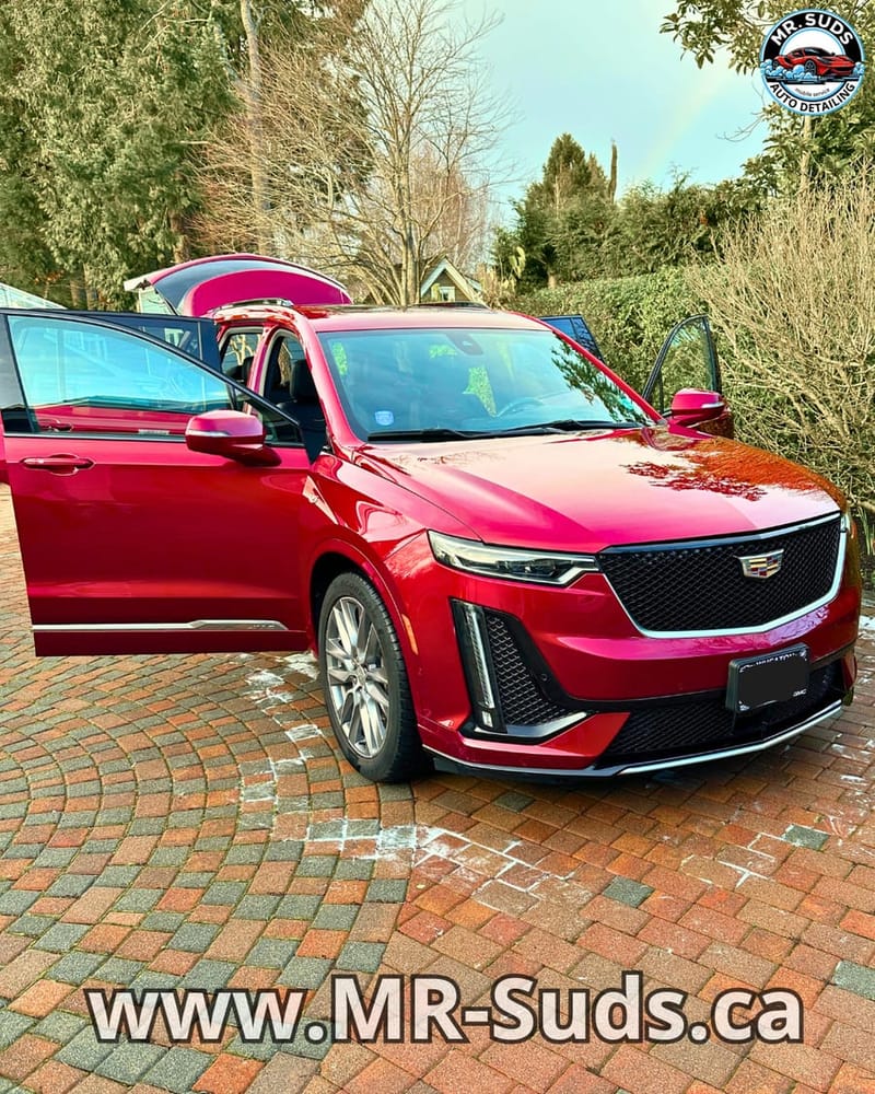 Red Cadillac SUV detailed by Mr. Suds